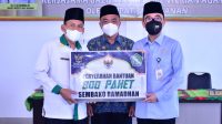 Bupati Waykanan Mengukuhkan UPZ dan Menyerahkan Bantuan Modal UMKM